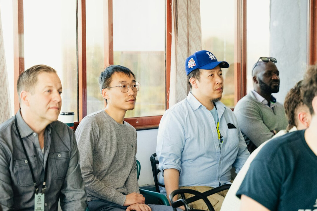 person speaking thoughtfully in seminar
