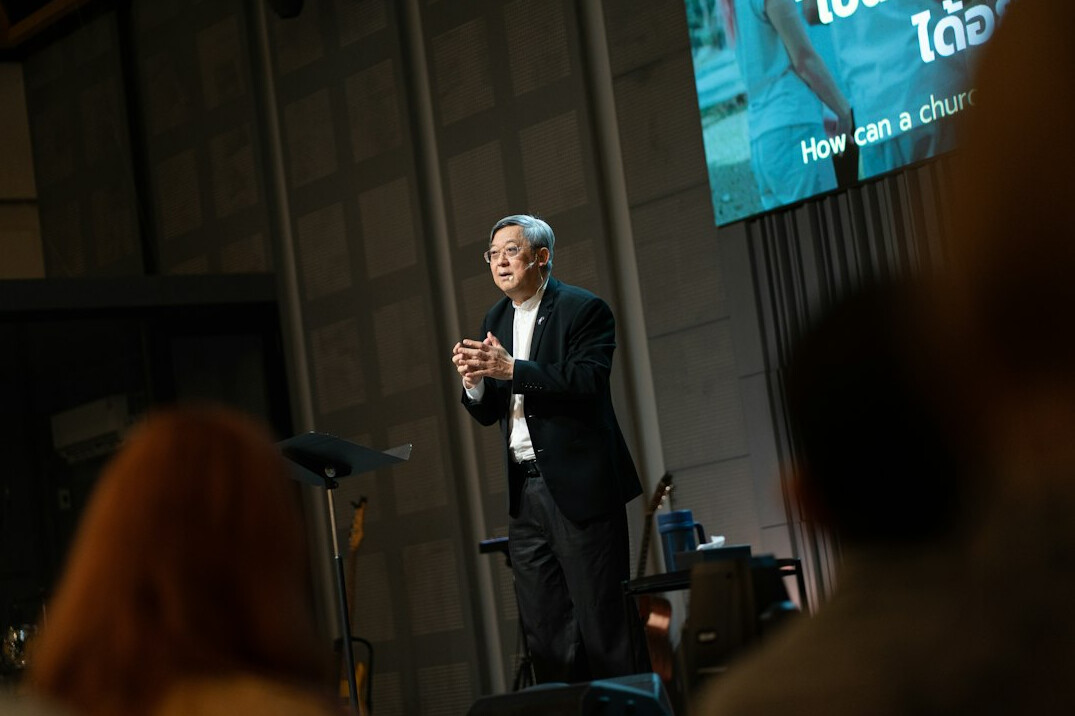 business professional speaking at conference