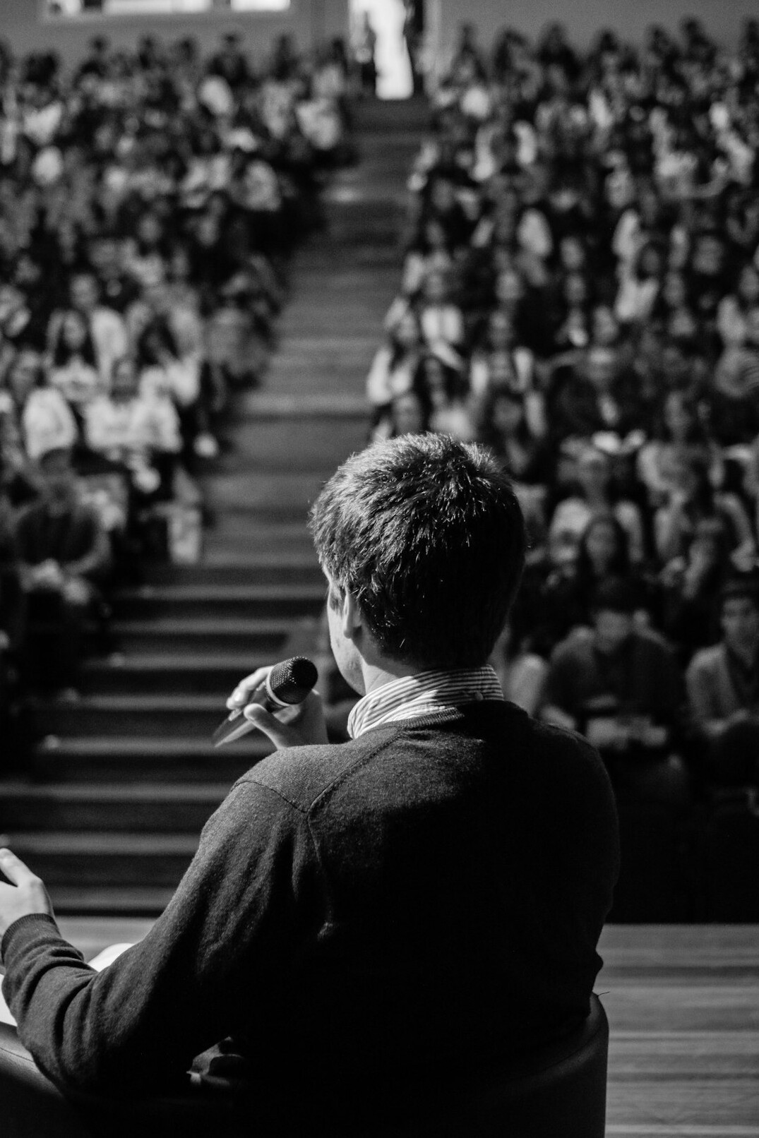thoughtful german speaker on stage