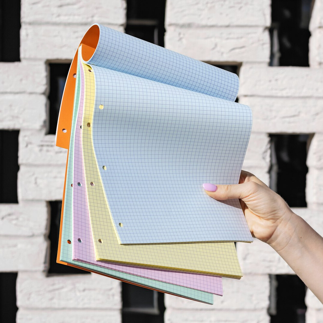 Open notebook with pen on a tidy wooden desk
